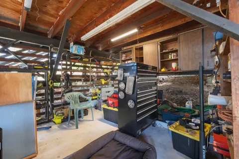 a view of a backyard with table and chairs