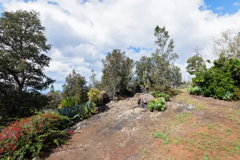 a view of a balcony with wooden floor