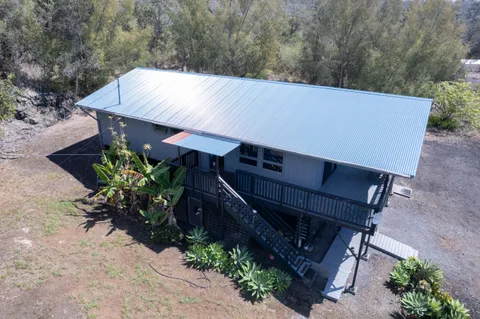 an aerial view of a house having yard