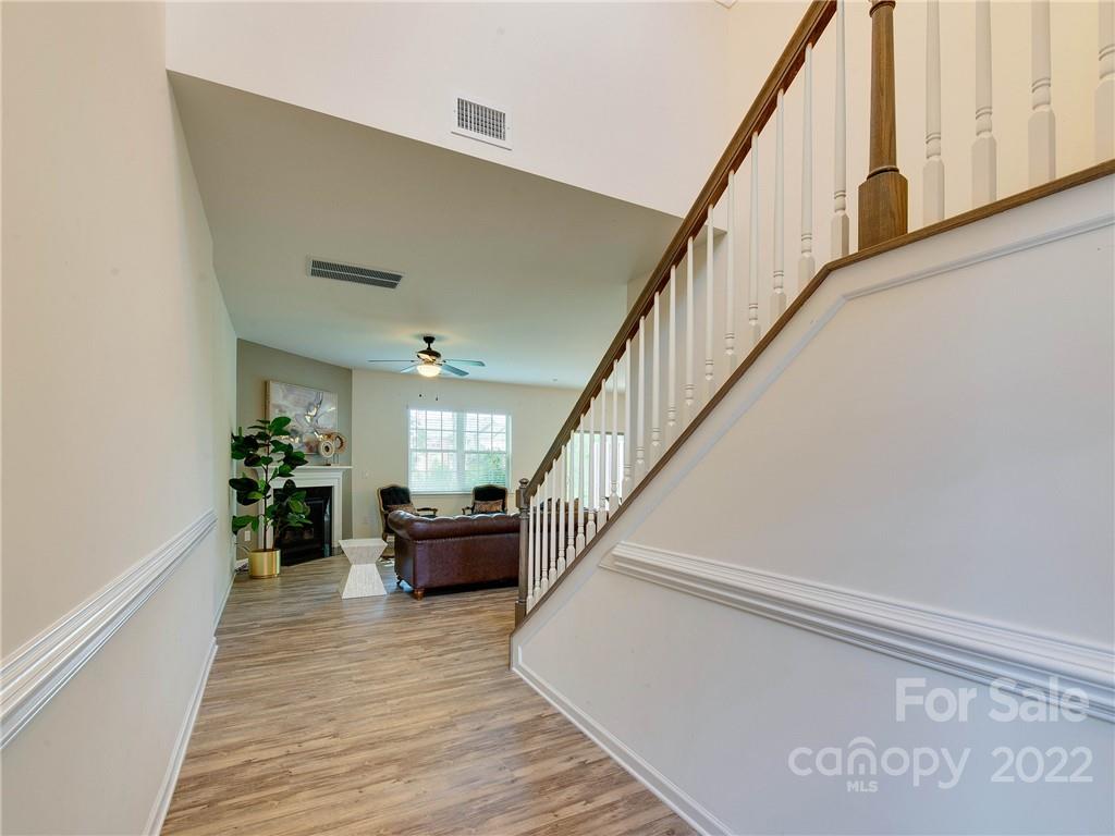 609 Amber Meadows Way Tega Cay, SC 29708 - Photo 3 of 42 a view of entryway and hall with wooden floor