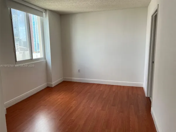 a view of an empty room and window