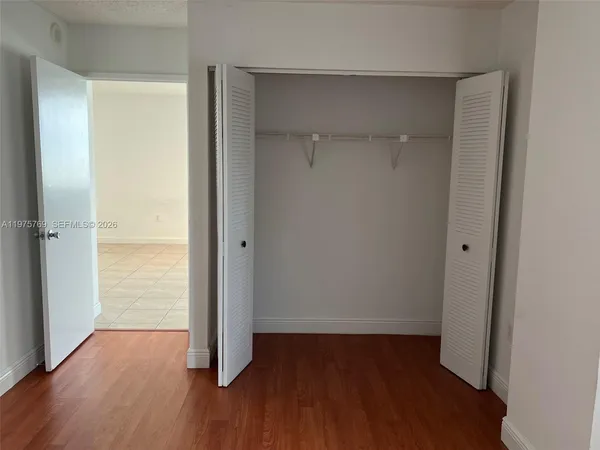 a workspace with furniture hardwood and a window