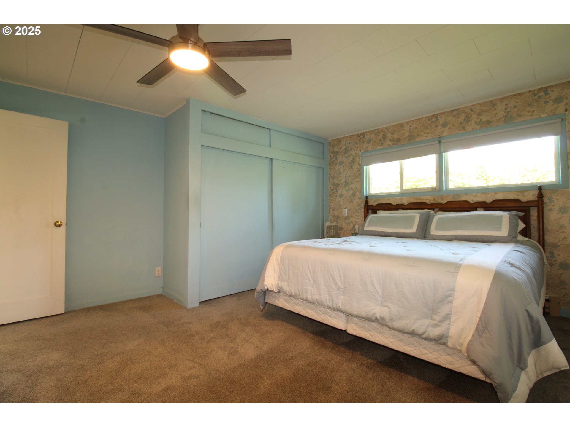 345 14th Street Springfield, OR 97477 - Photo 11 of 23 a bedroom with a bed and a window