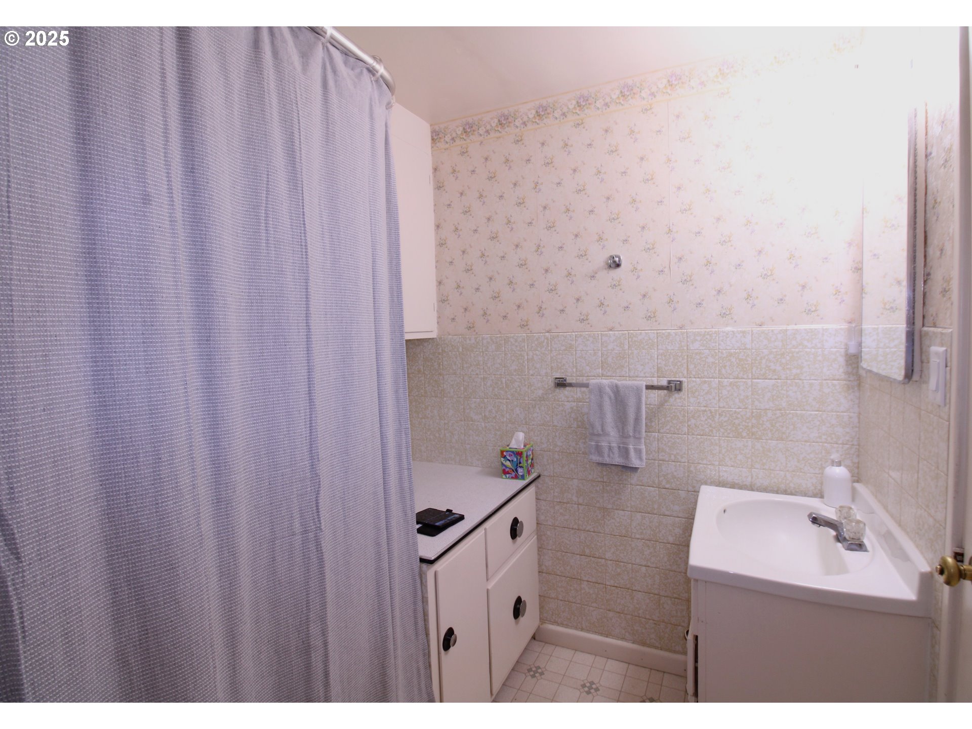 345 14th Street Springfield, OR 97477 - Photo 15 of 23 a bathroom with a sink and mirror