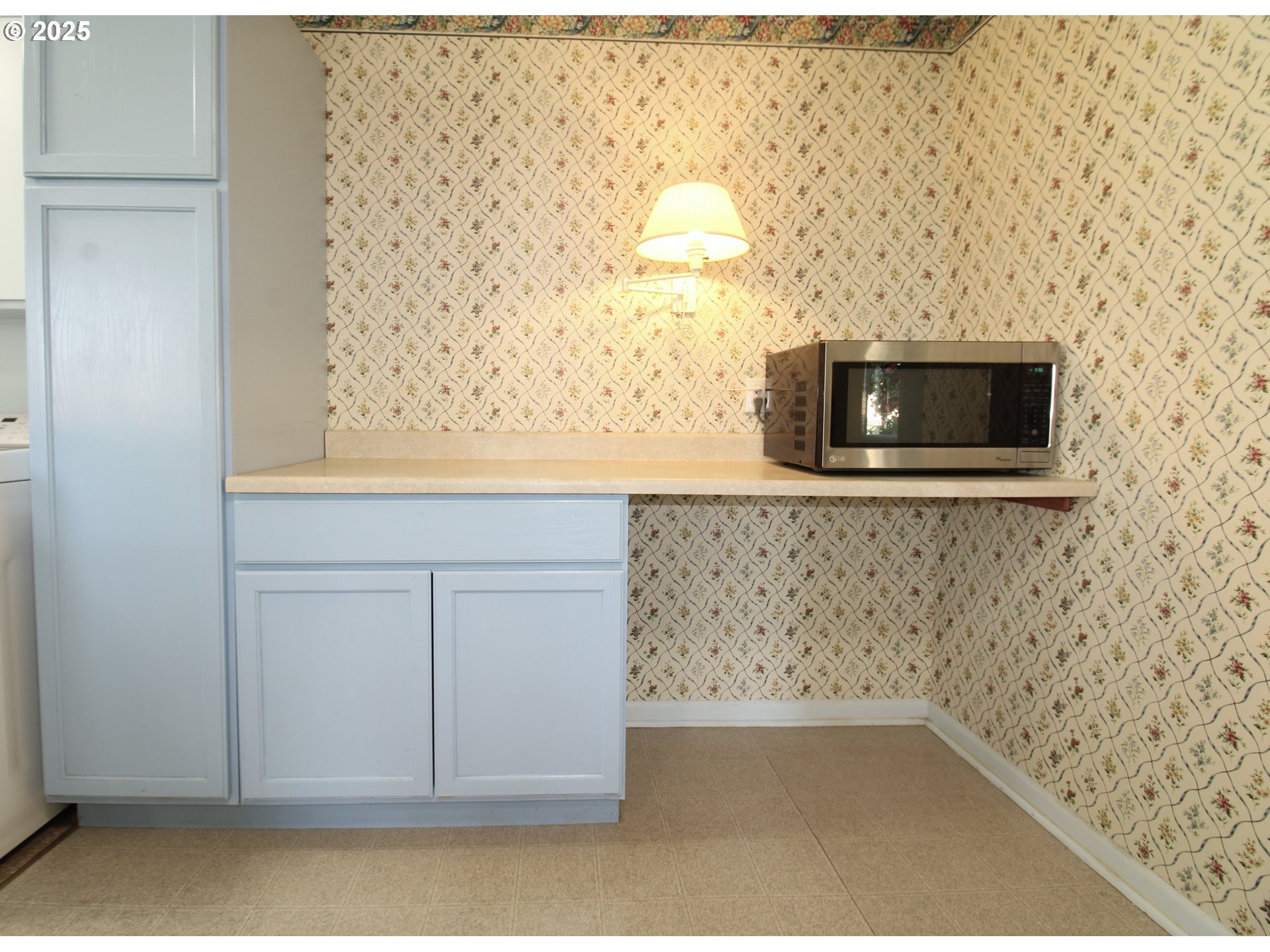 345 14th Street Springfield, OR 97477 - Photo 16 of 23 a bathroom with a sink and a microwave oven