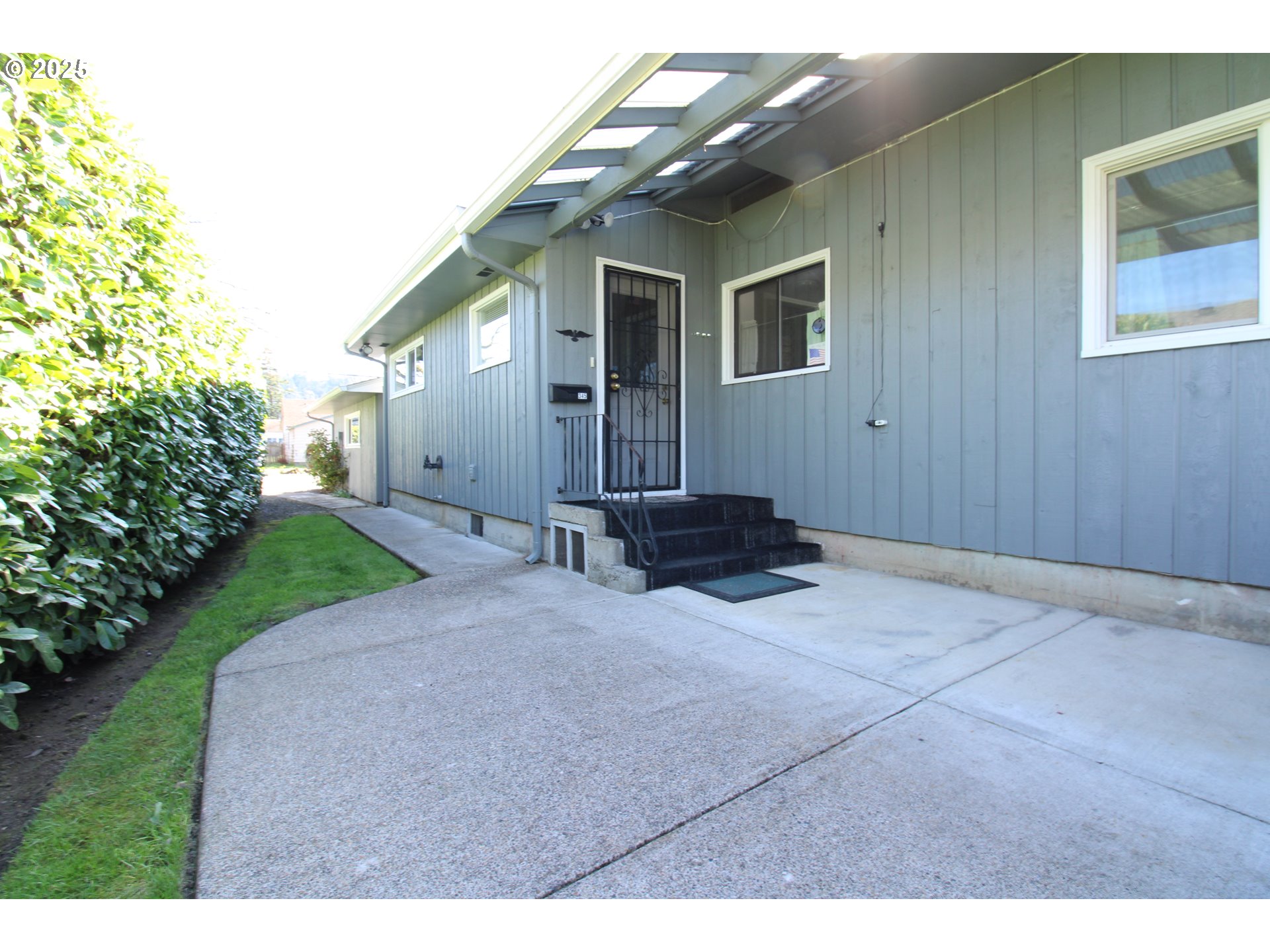 345 14th Street Springfield, OR 97477 - Photo 18 of 23 a backyard of a house with yard and outdoor seating