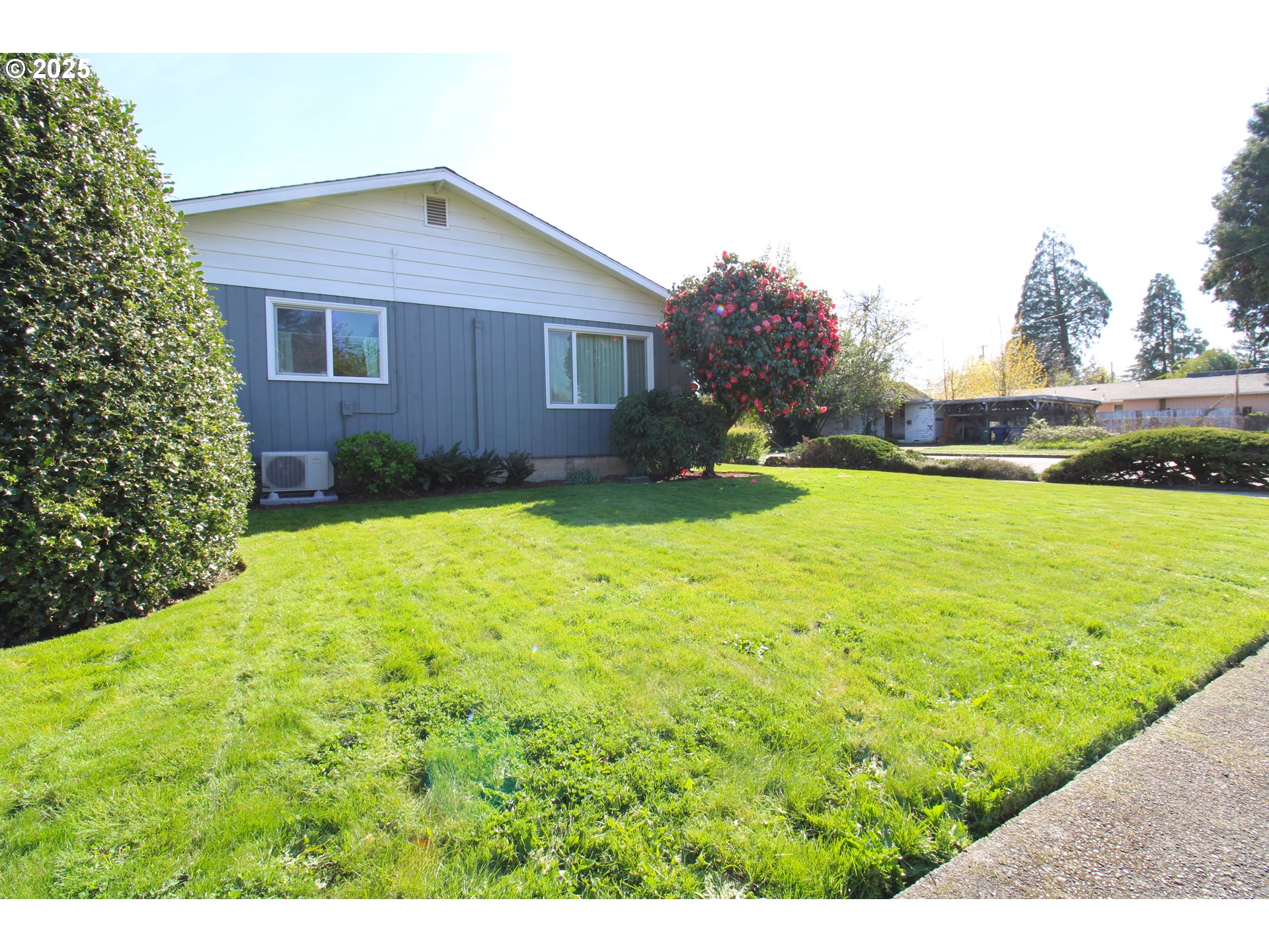 345 14th Street Springfield, OR 97477 - Photo 2 of 23 a view of a house with a yard and sitting area