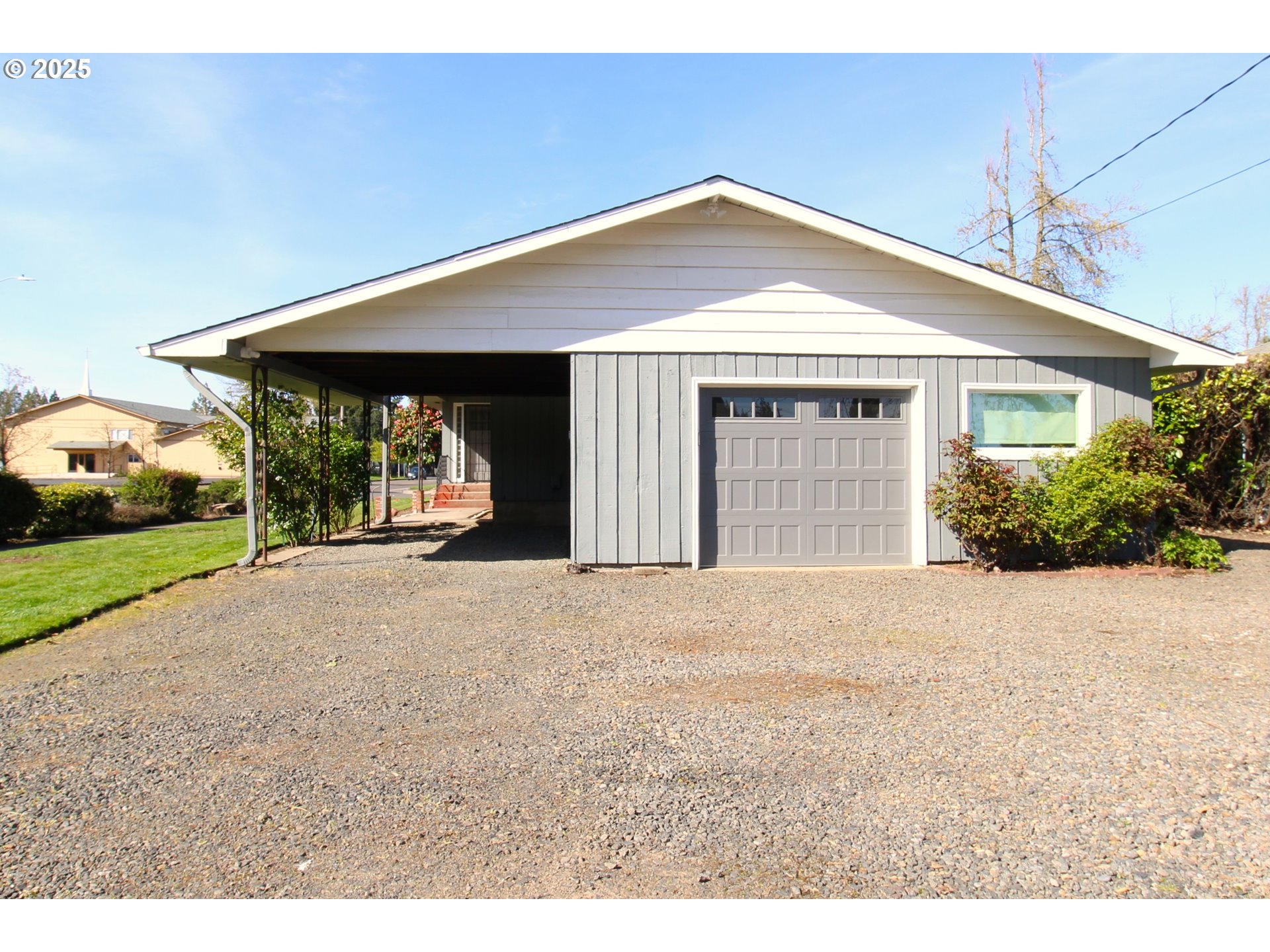 345 14th Street Springfield, OR 97477 - Photo 4 of 23 a front view of a house with a yard and garage
