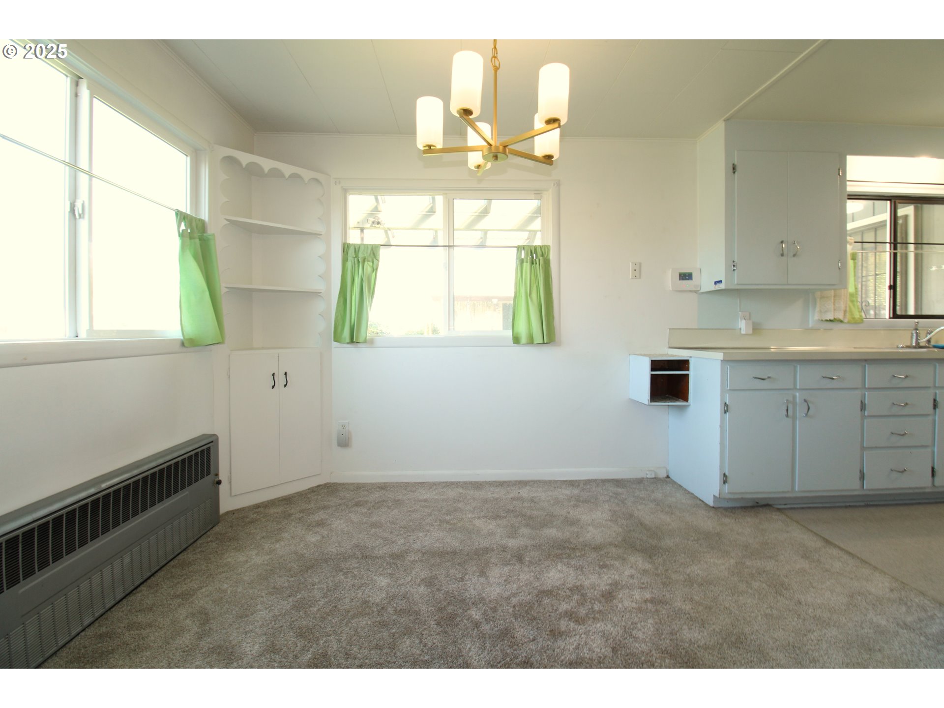 345 14th Street Springfield, OR 97477 - Photo 7 of 23 a view of a kitchen with wooden floor and windows