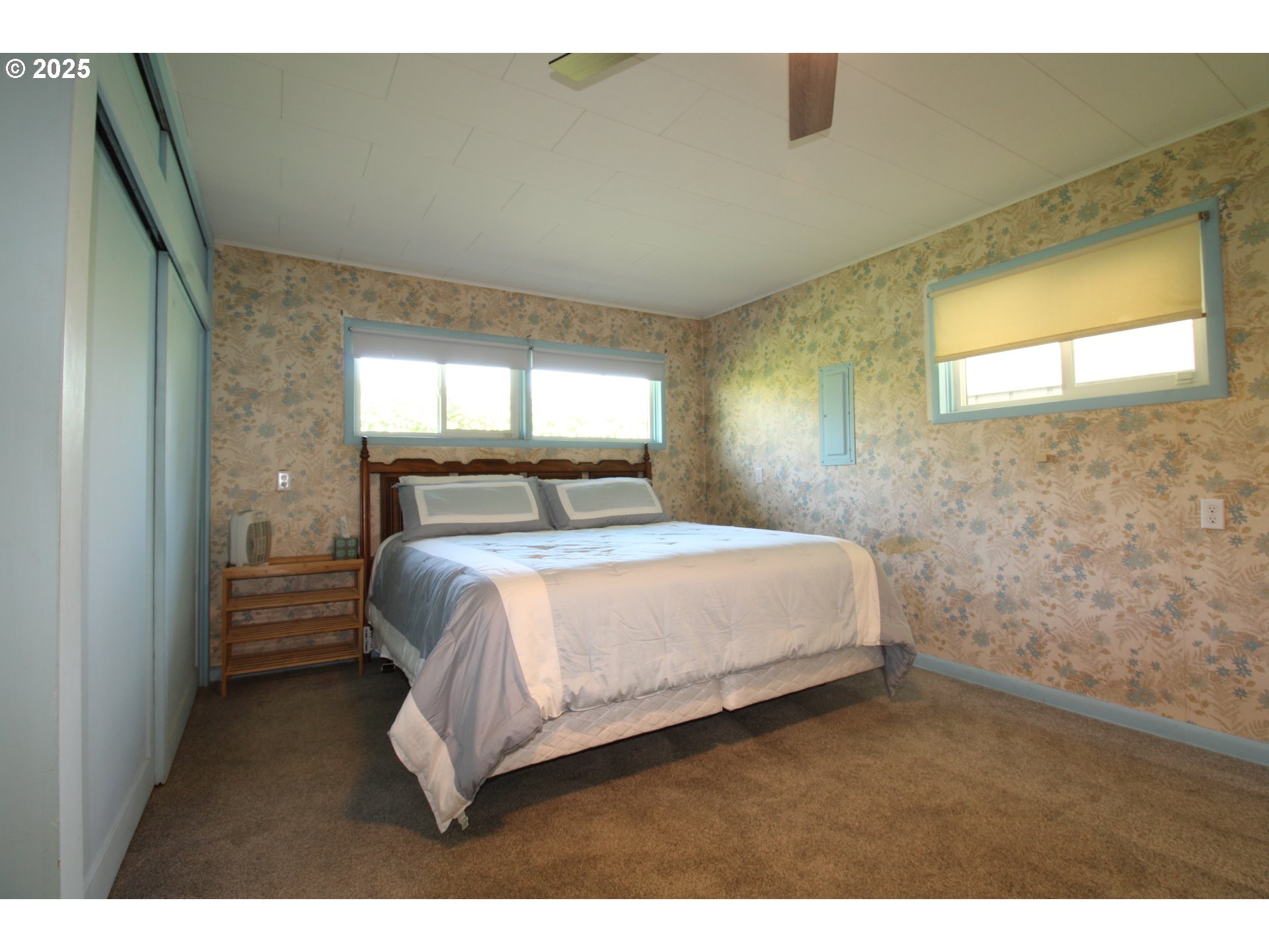 345 14th Street Springfield, OR 97477 - Photo 10 of 23 a bedroom with a bed and a window