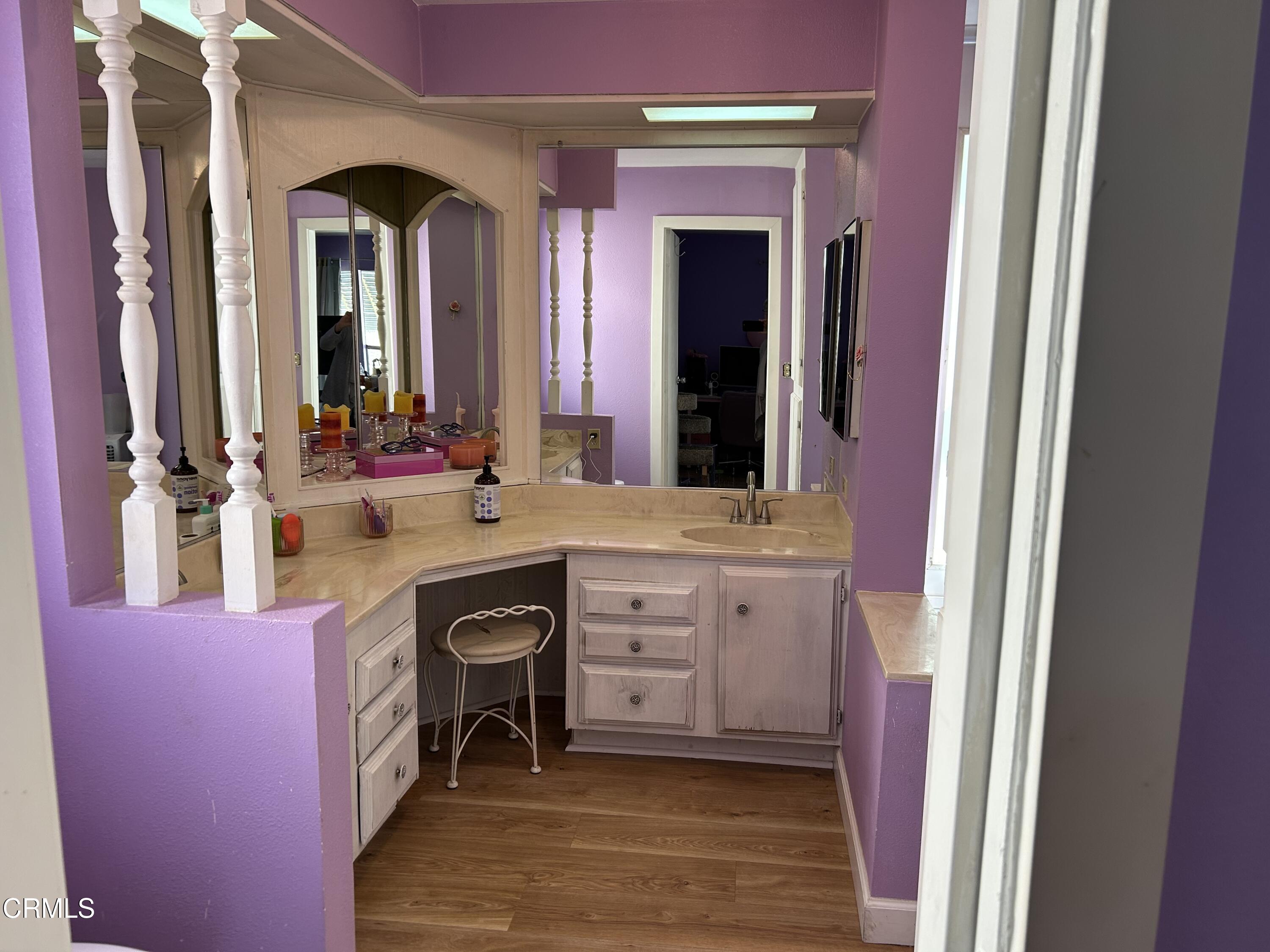 142 Geranium Way, Unit 142 Ventura, CA 93004 - Photo 15 of 23 a bathroom with a sink a vanity and a mirror