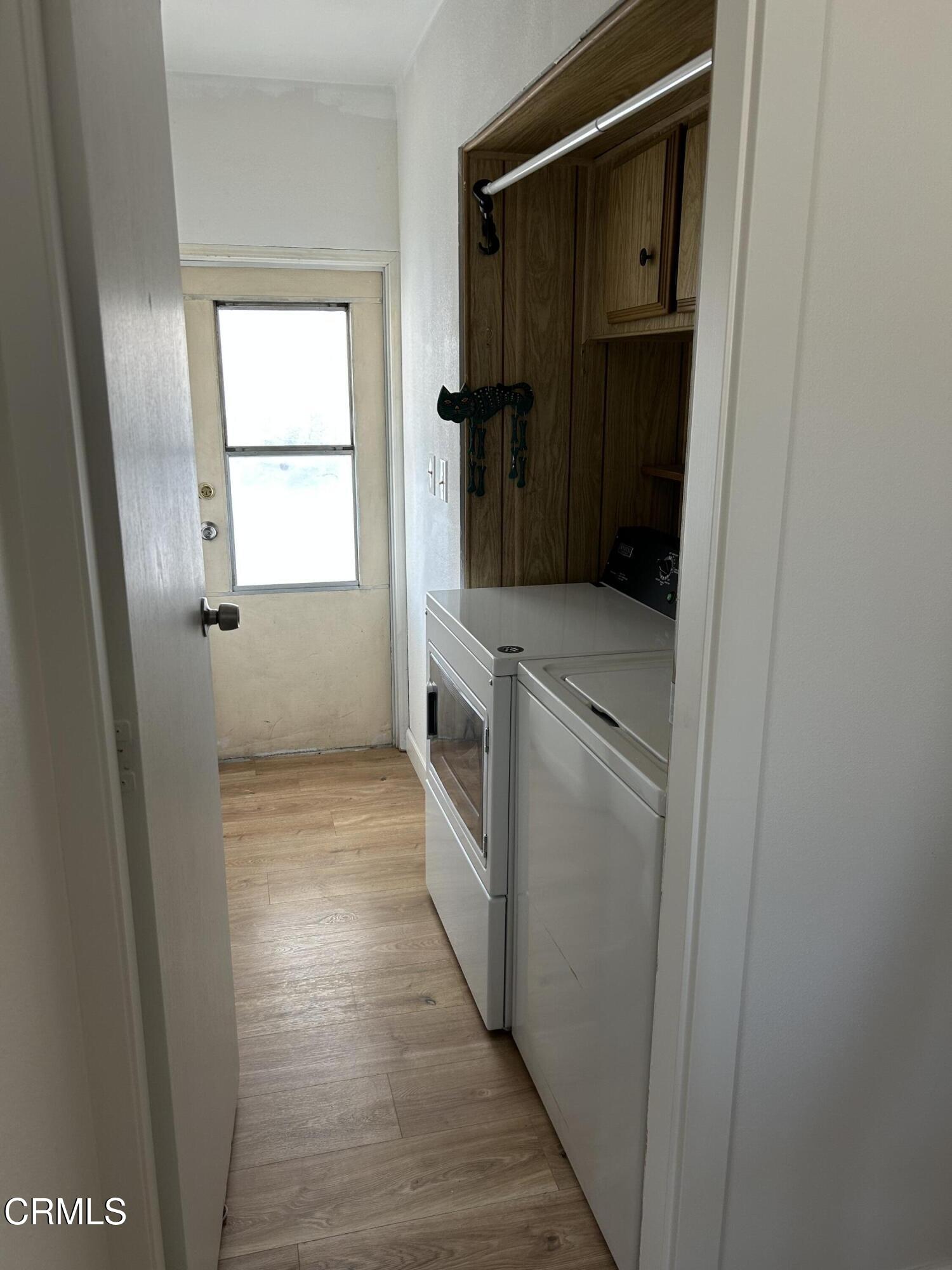 142 Geranium Way, Unit 142 Ventura, CA 93004 - Photo 20 of 23 a bathroom with a double vanity sink and a window