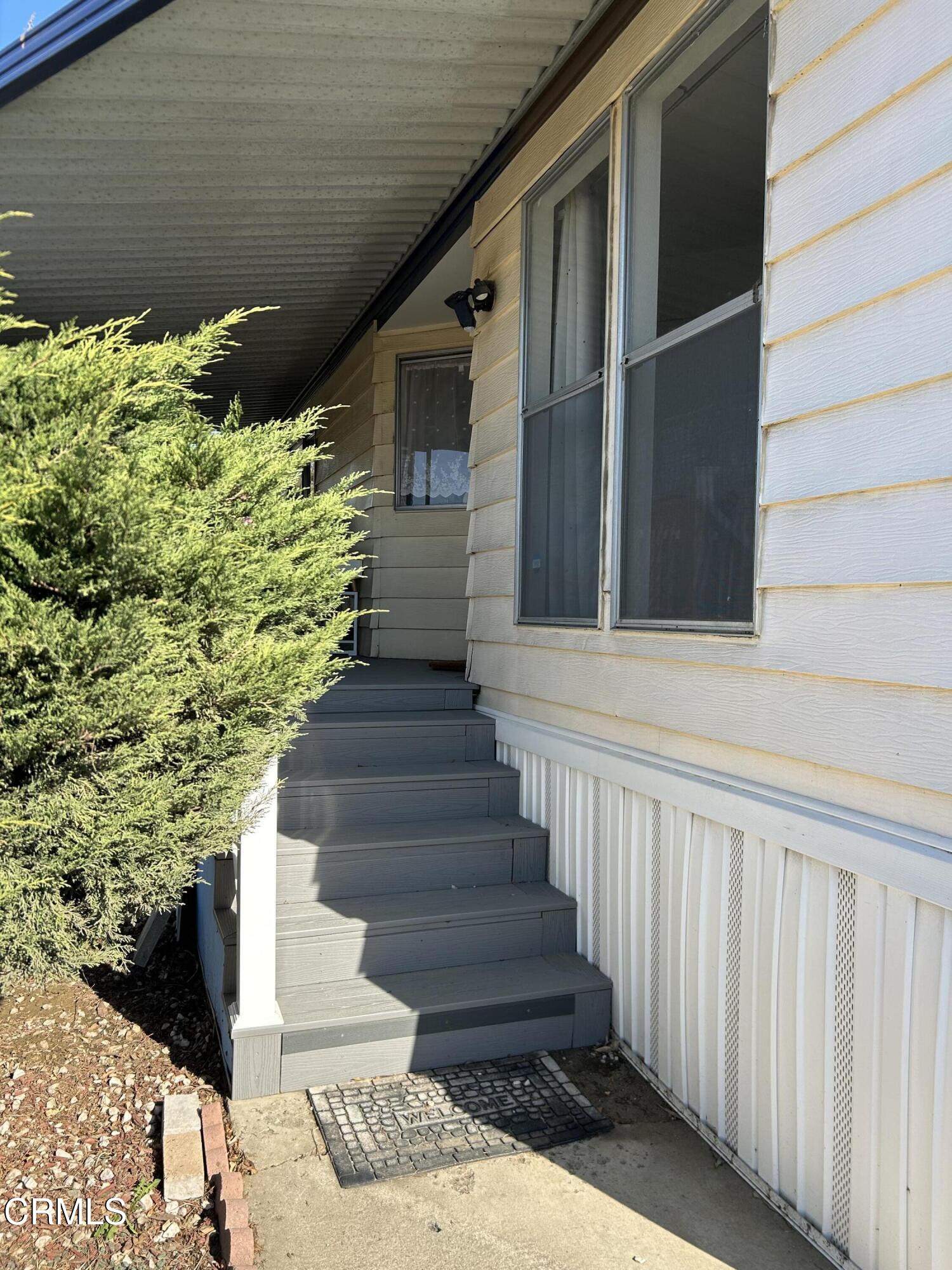 142 Geranium Way, Unit 142 Ventura, CA 93004 - Photo 21 of 23 a stairs of a house with a yard