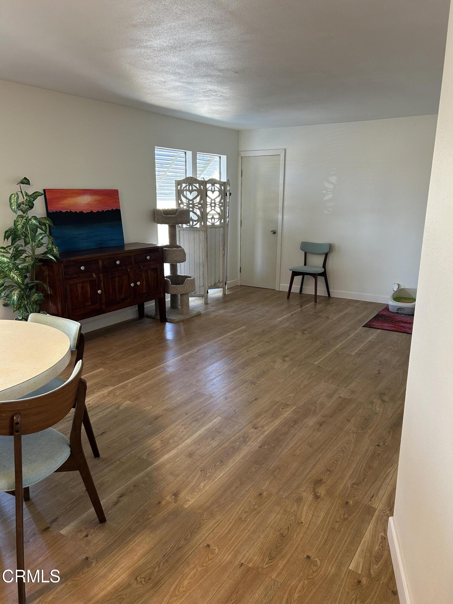 142 Geranium Way, Unit 142 Ventura, CA 93004 - Photo 7 of 23 a living room with furniture and a flat screen tv