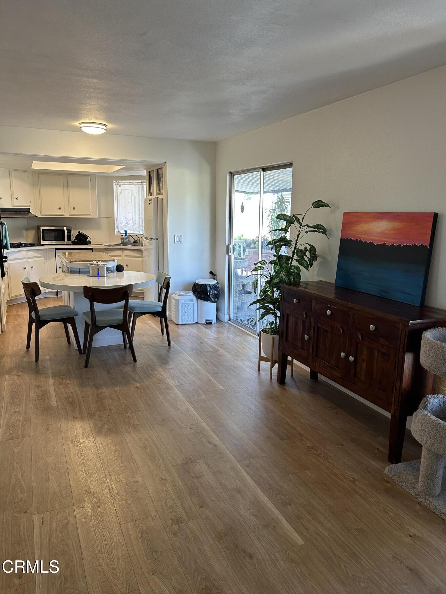 142 Geranium Way, Unit 142 Ventura, CA 93004 - Photo 8 of 23 a living room with furniture and a flat screen tv