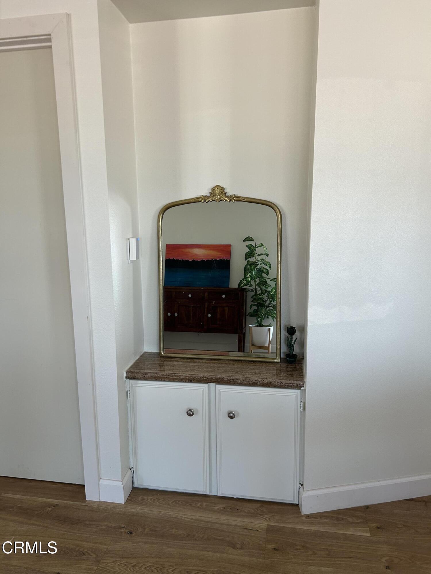 142 Geranium Way, Unit 142 Ventura, CA 93004 - Photo 9 of 23 a view of front door with wooden floor