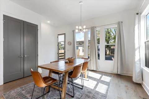 a view of a dining room with furniture window and wooden floor
