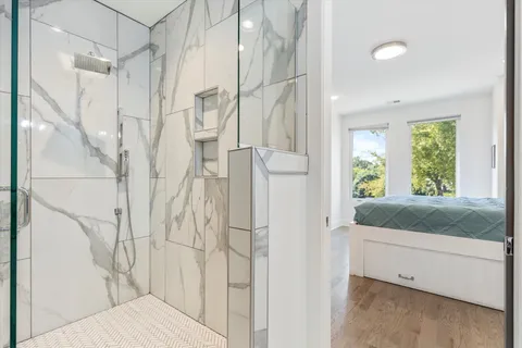 a bathroom with a bathtub and shower