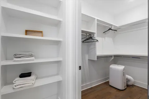 a view of storage and utility room with empty racks