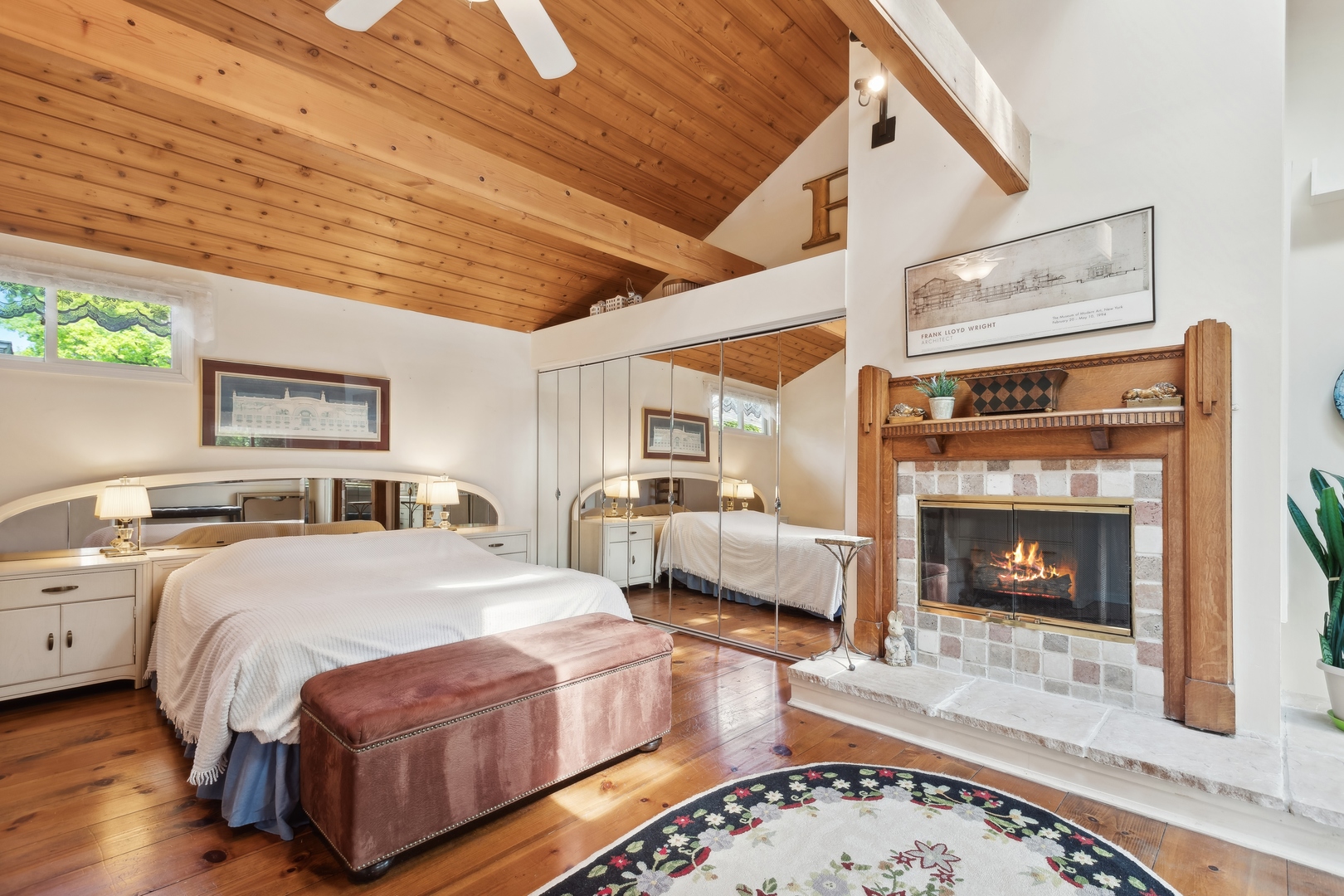 21368 West Pepper Road Lake Zurich, IL 60047 - Photo 14 of 24 a bedroom with a bed and a fireplace