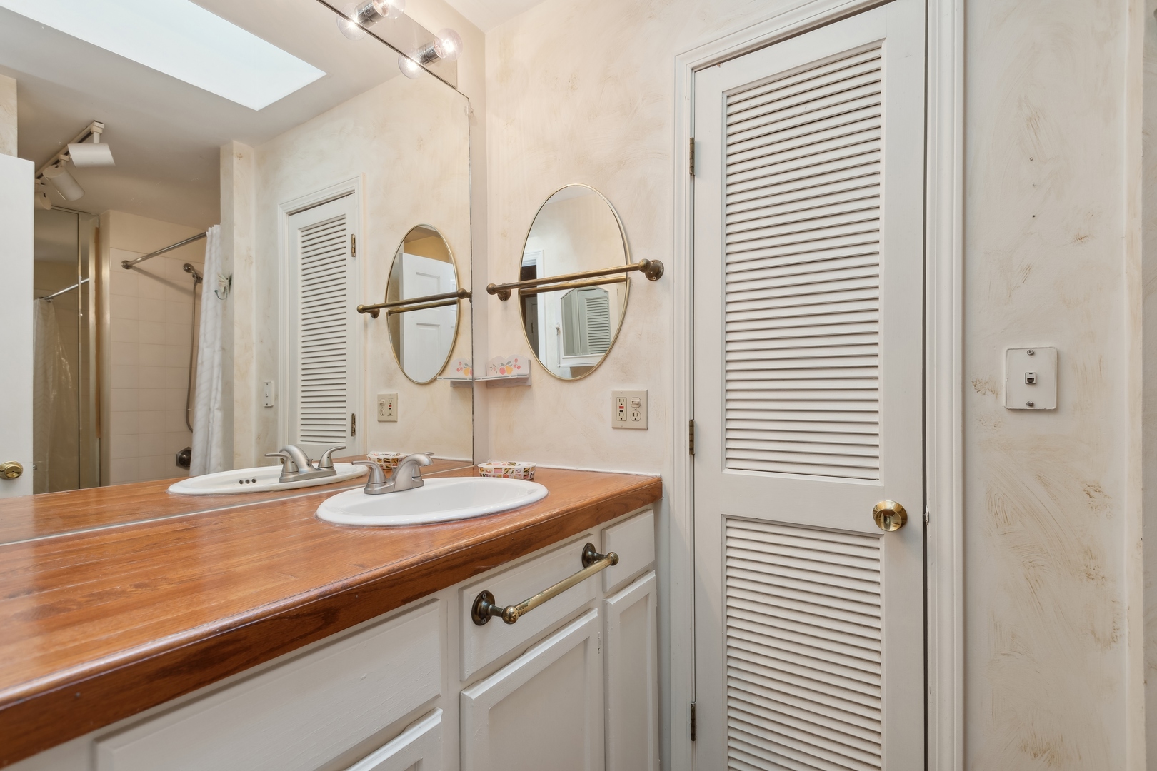 21368 West Pepper Road Lake Zurich, IL 60047 - Photo 17 of 24 a bathroom with a sink and a mirror