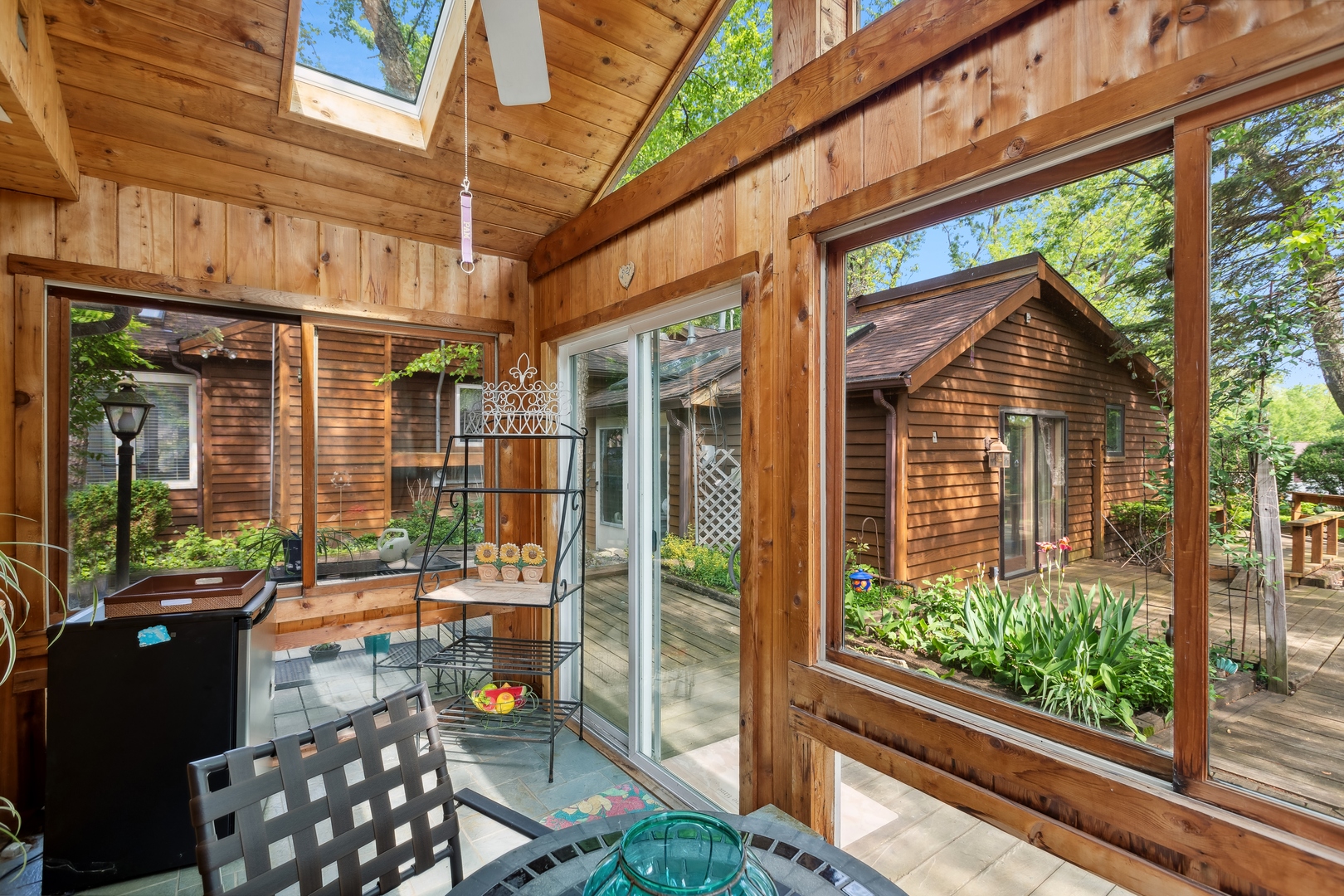 21368 West Pepper Road Lake Zurich, IL 60047 - Photo 19 of 24 a view of a porch with chairs and floor to ceiling window
