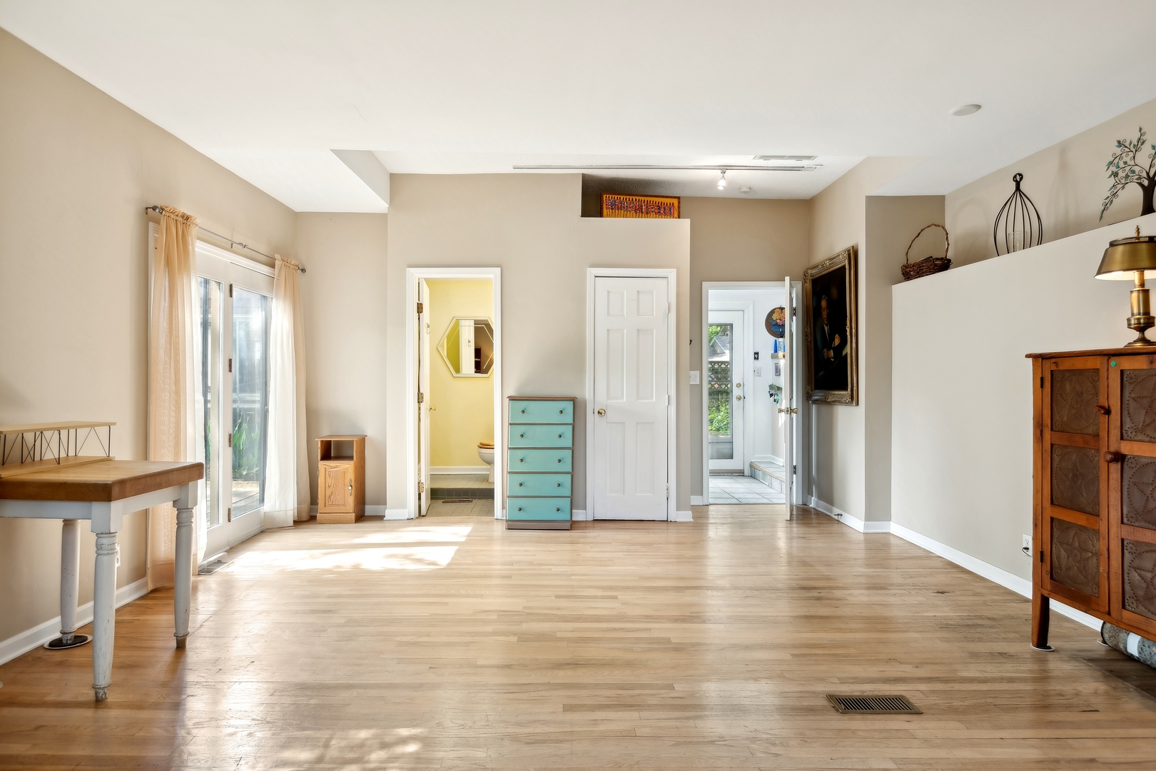 21368 West Pepper Road Lake Zurich, IL 60047 - Photo 3 of 24 a view of a big room with wooden floor and windows