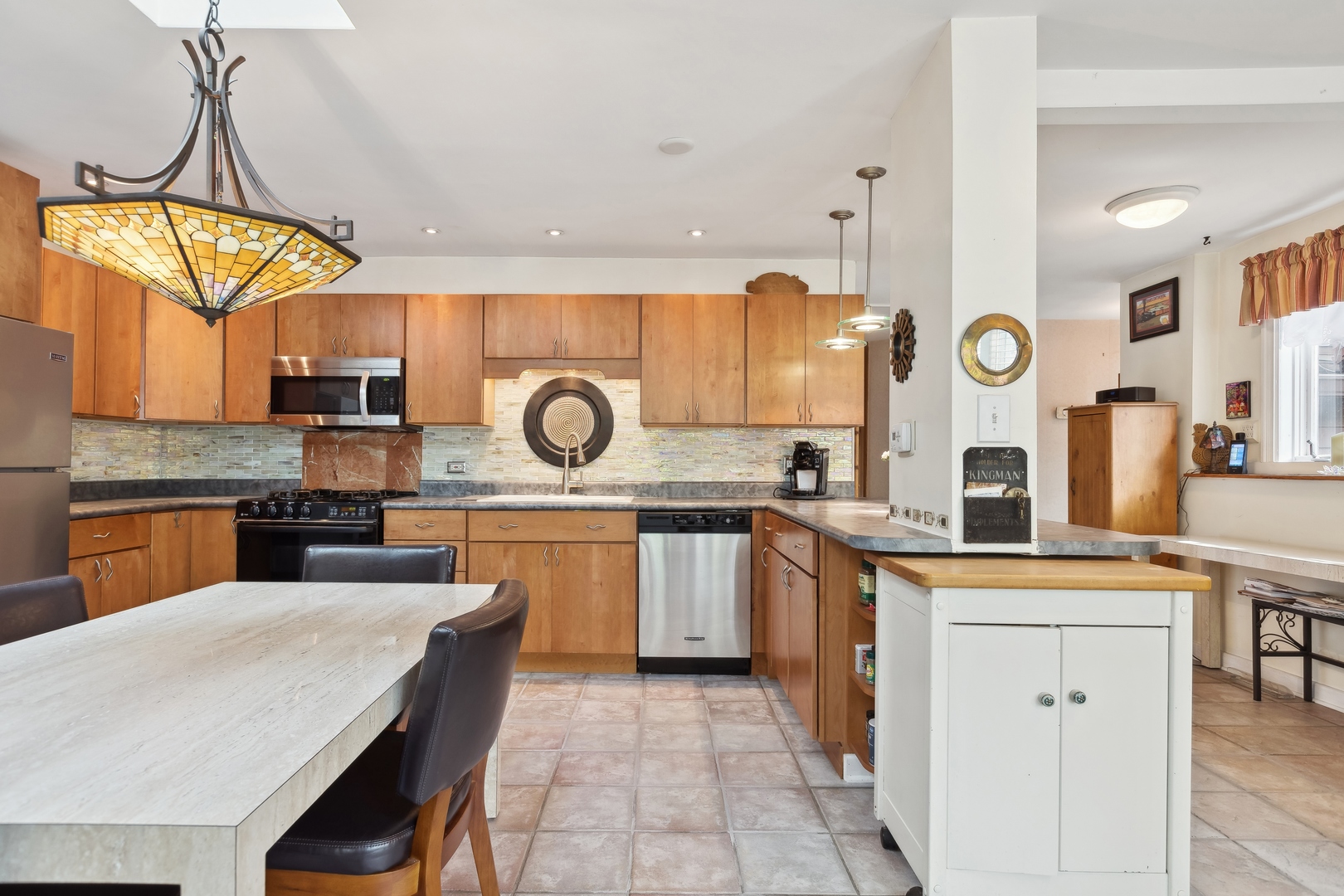 21368 West Pepper Road Lake Zurich, IL 60047 - Photo 6 of 24 a kitchen with a sink a stove top oven and clock