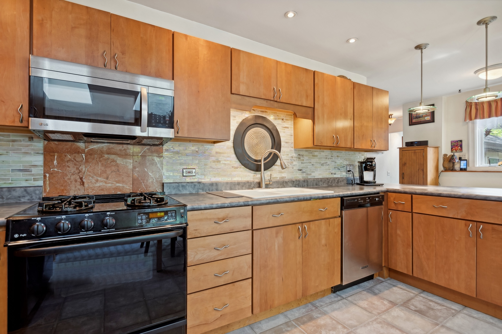 21368 West Pepper Road Lake Zurich, IL 60047 - Photo 7 of 24 a kitchen with granite countertop a stove and a sink