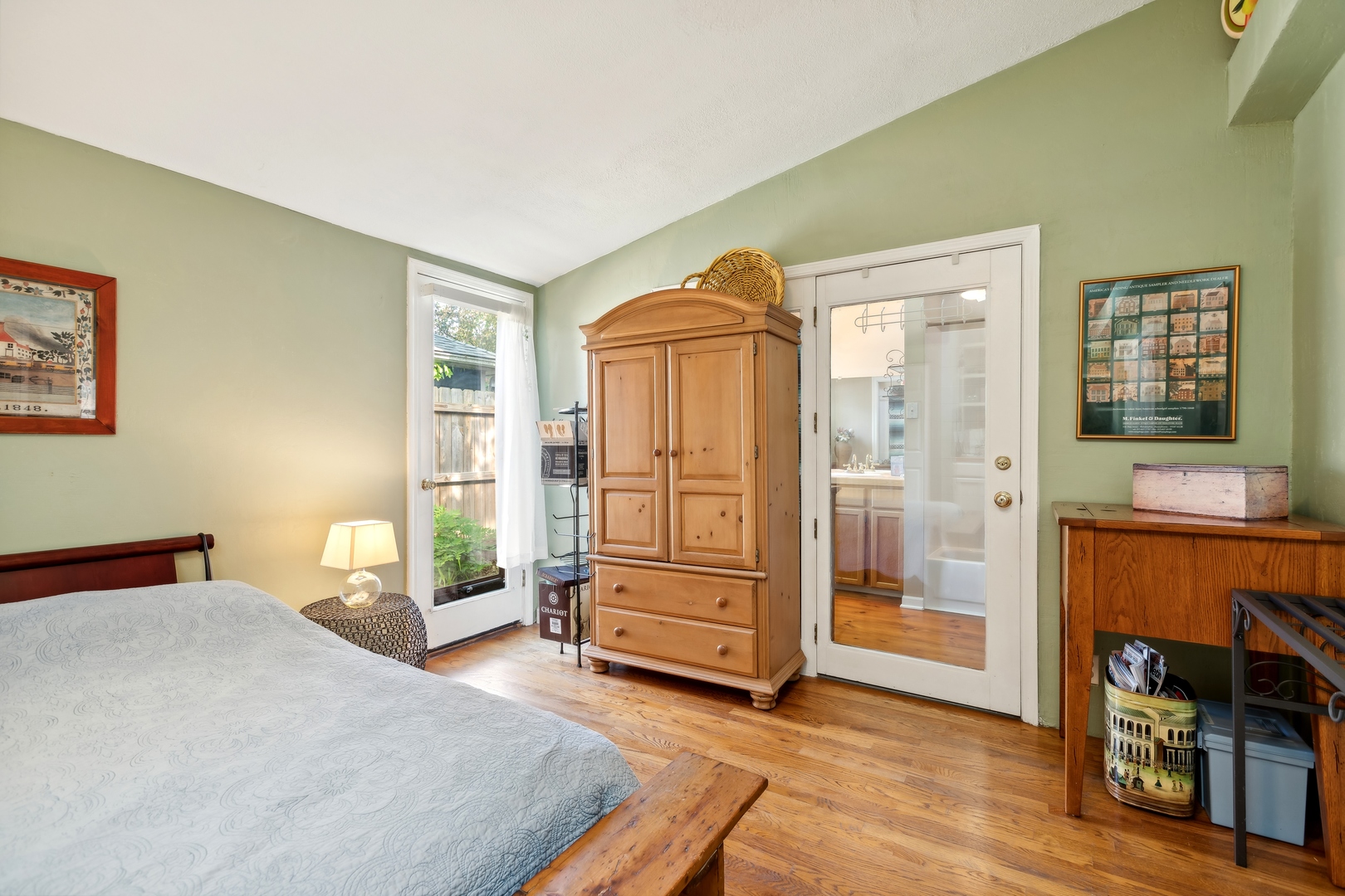 21368 West Pepper Road Lake Zurich, IL 60047 - Photo 10 of 24 a bedroom with a bed and a chair