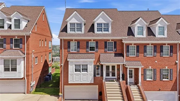 a view of a brick building next to a yard