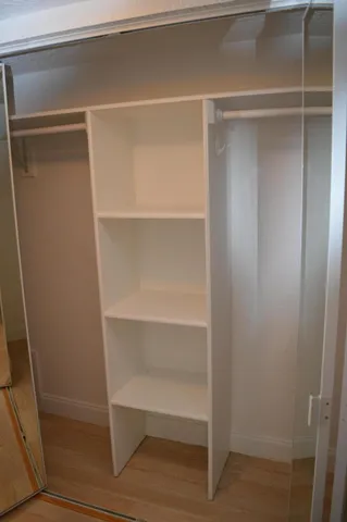 a view of an empty walk in closet
