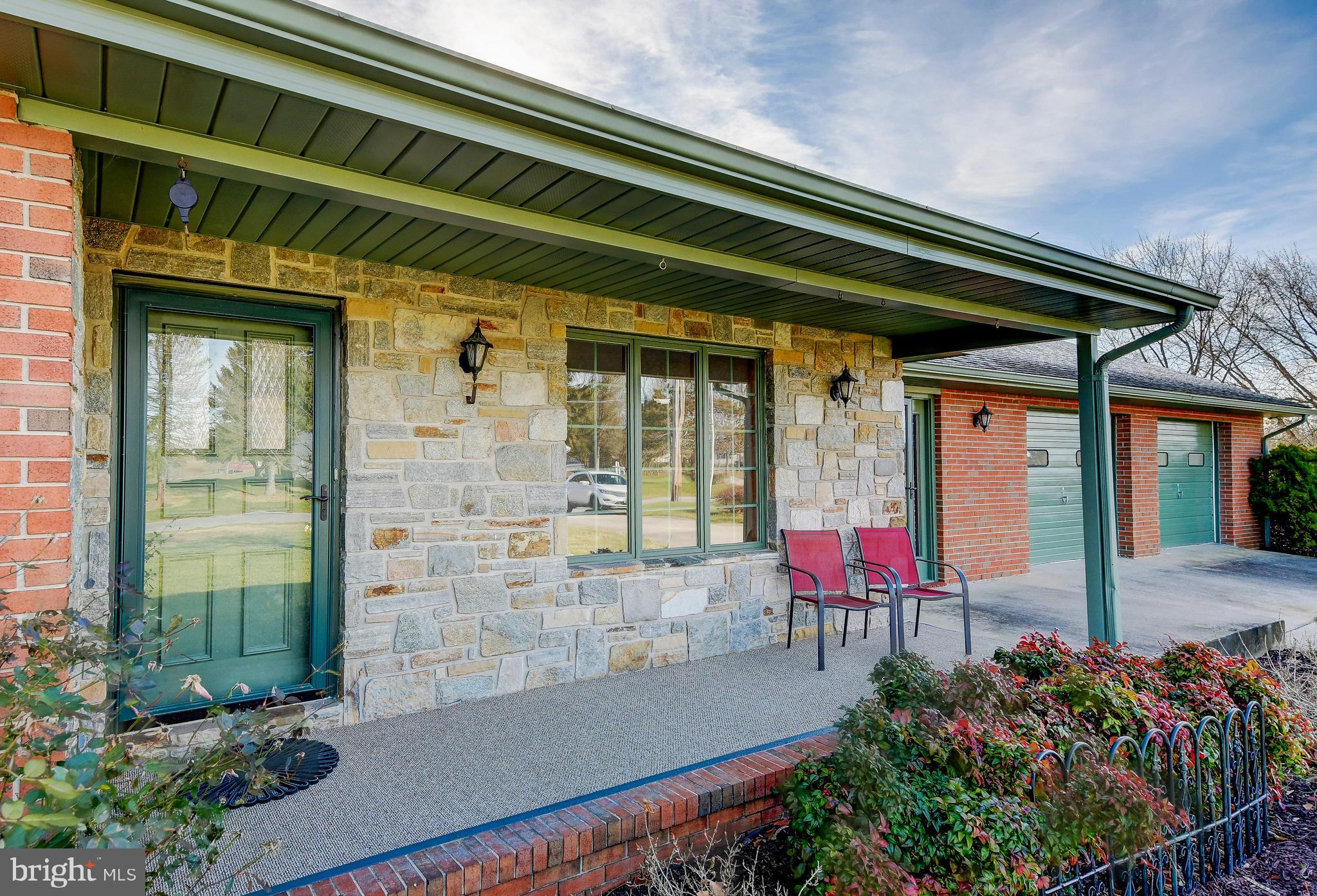 9 West McKinley Road Delta, PA 17314 - Photo 4 of 40 Cozy Covered Front Porch adorned with stone