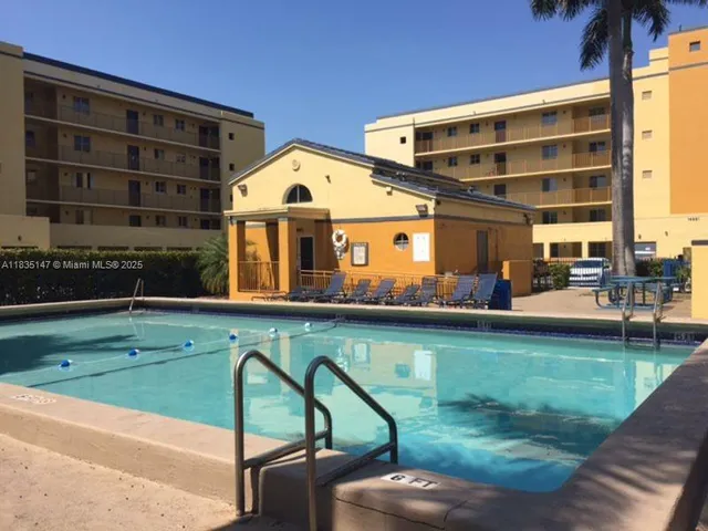 a front view of building with yard