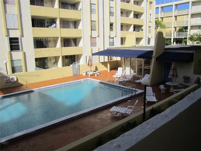 a living room with a table and chair