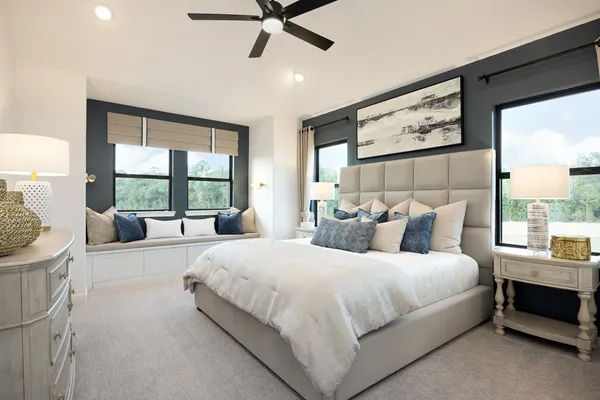 a bedroom with a large bed and a window