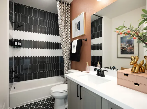 a bathroom with a sink a toilet and a bathtub