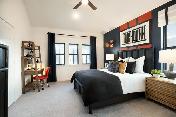 a living room with bed furniture and a window