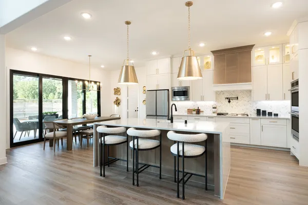 a kitchen with lots of counter space and furniture