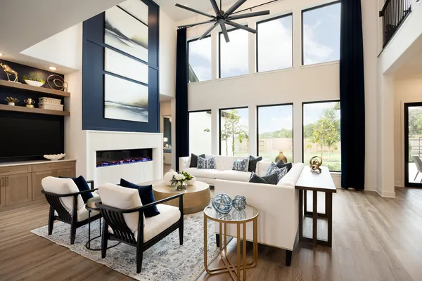 a dining room with furniture a fireplace and wooden floor