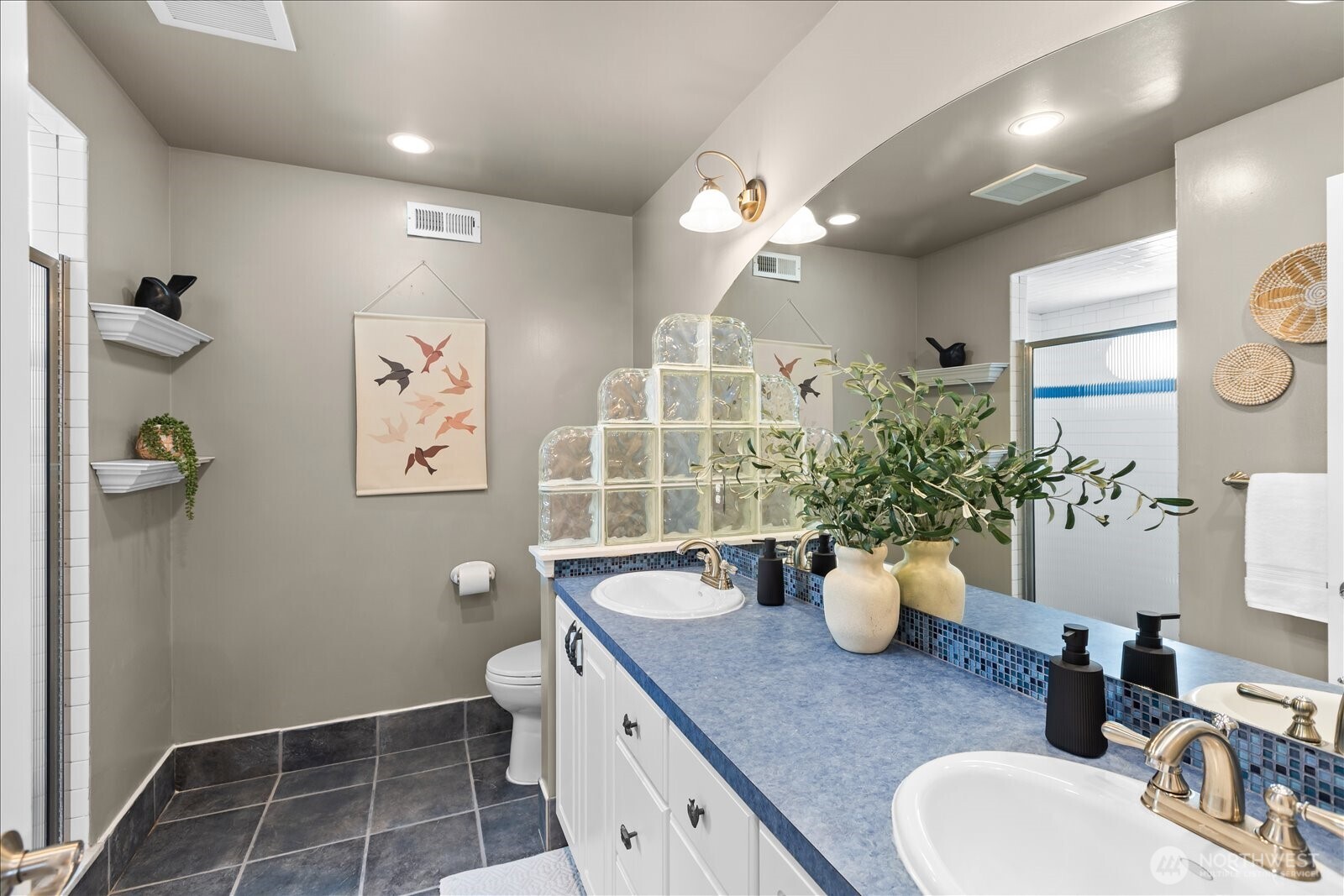 831 Northstream Lane Edmonds, WA 98020 - Photo 33 of 40 a bathroom with a sink a toilet and shower