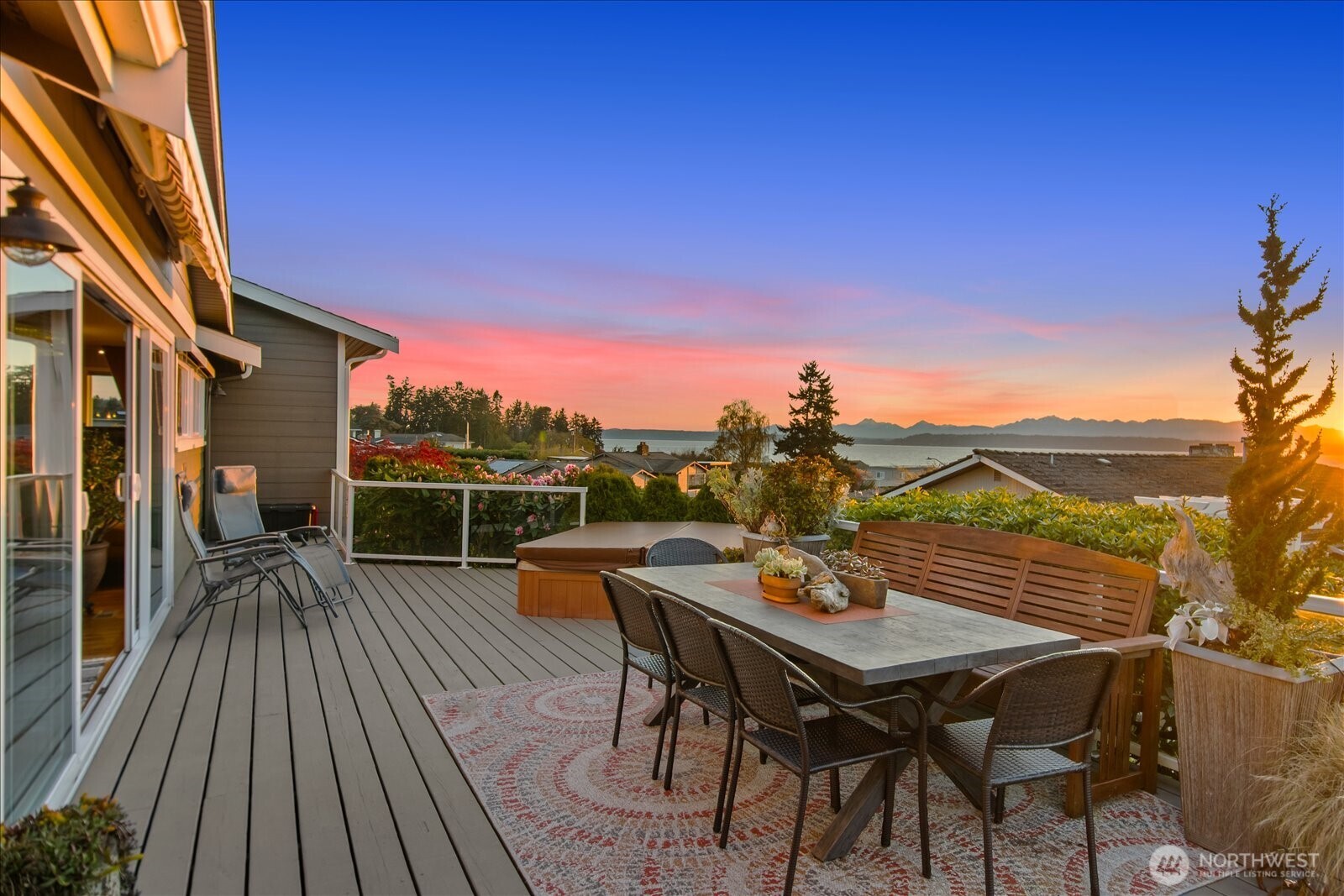 831 Northstream Lane Edmonds, WA 98020 - Photo 5 of 40 a view of a roof deck with table and chairs and wooden floor