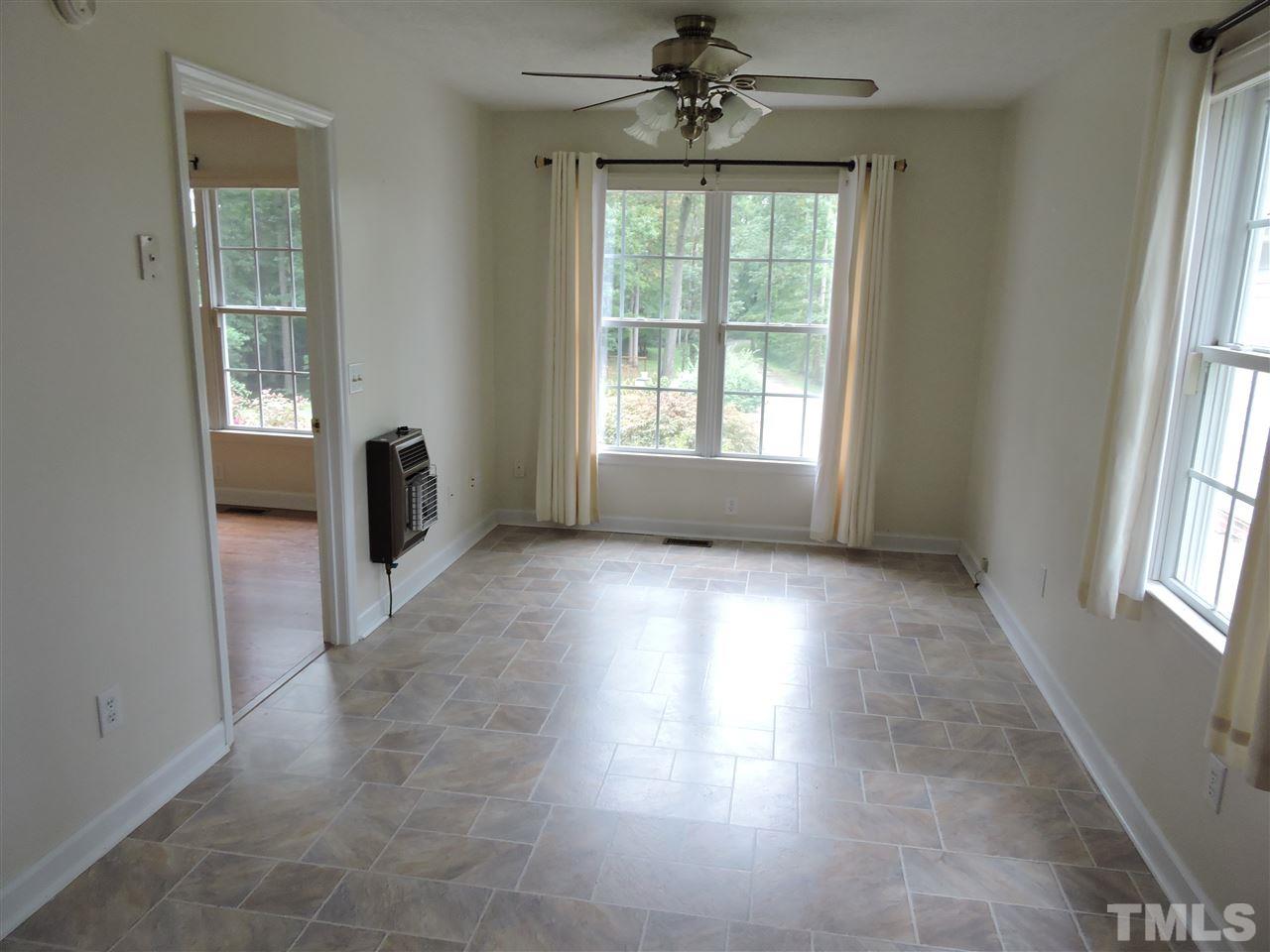49 Epps Martin Road Roxboro, NC 27574 - Photo 12 of 25 a view of a livingroom with a ceiling fan and window