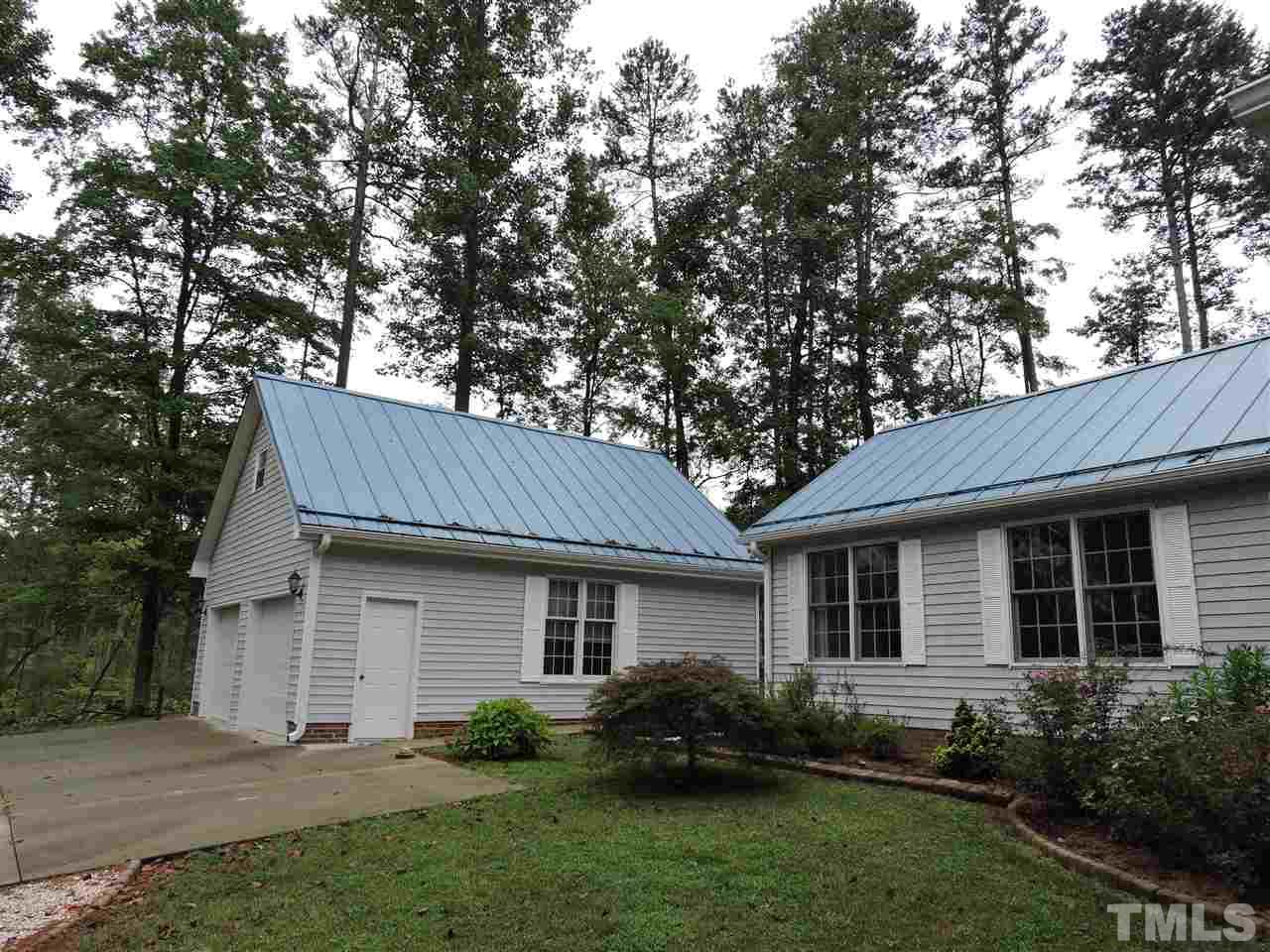 49 Epps Martin Road Roxboro, NC 27574 - Photo 15 of 25 a view of a house with a yard plants and large tree