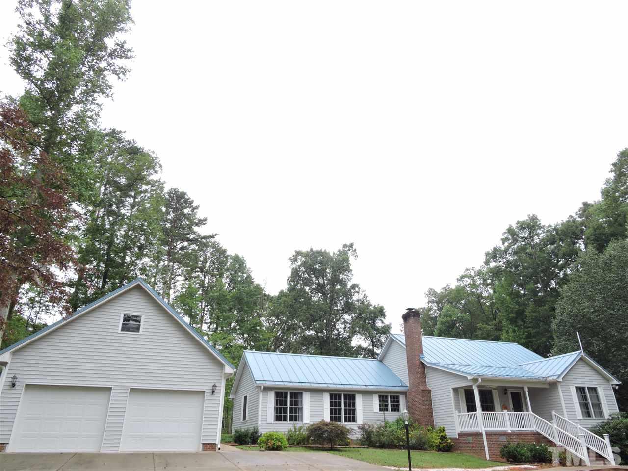 49 Epps Martin Road Roxboro, NC 27574 - Photo 16 of 25 a front view of a house with a yard