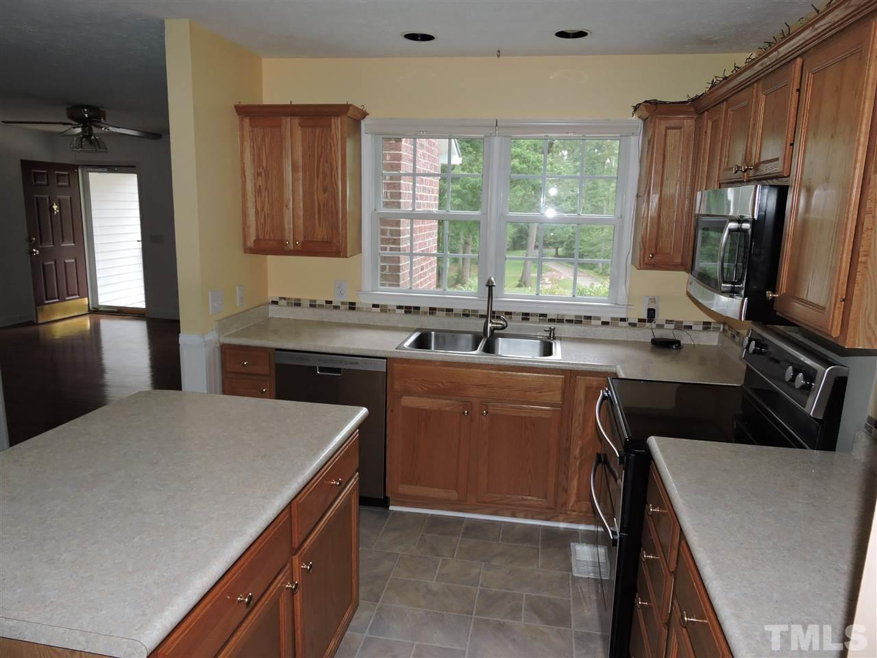 49 Epps Martin Road Roxboro, NC 27574 - Photo 3 of 25 a kitchen with a sink stove and refrigerator