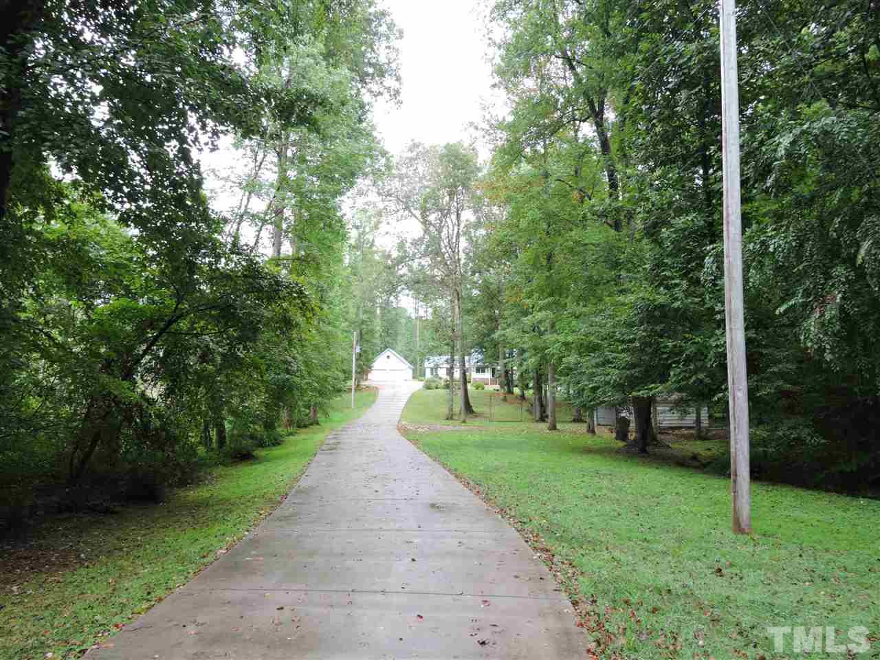 49 Epps Martin Road Roxboro, NC 27574 - Photo 24 of 25 a view of a street with a trees