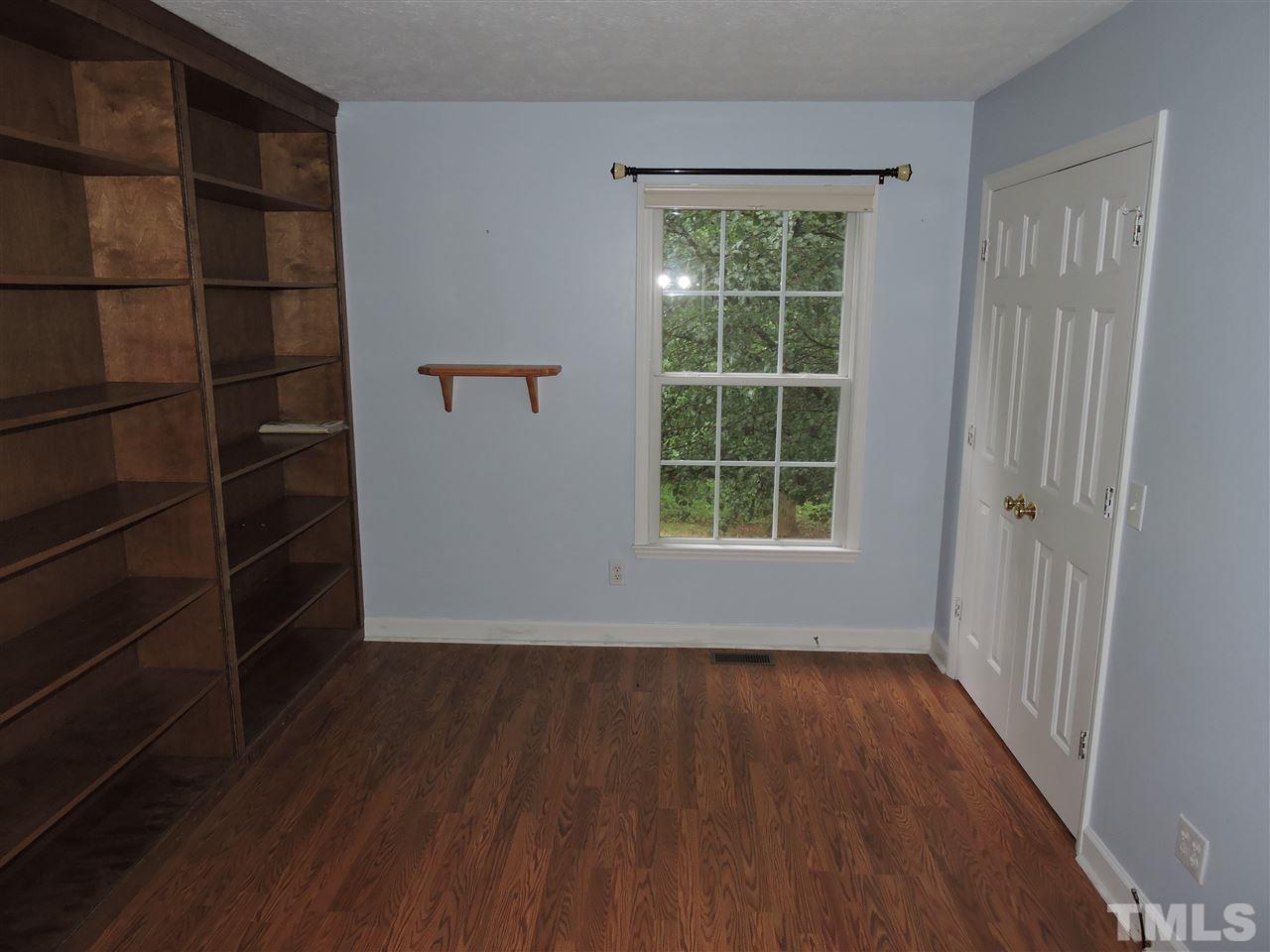 49 Epps Martin Road Roxboro, NC 27574 - Photo 8 of 25 a view of a room with wooden floor and windows
