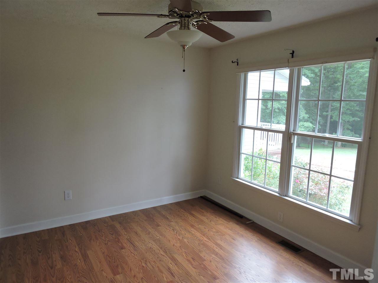 49 Epps Martin Road Roxboro, NC 27574 - Photo 9 of 25 an empty room with a window