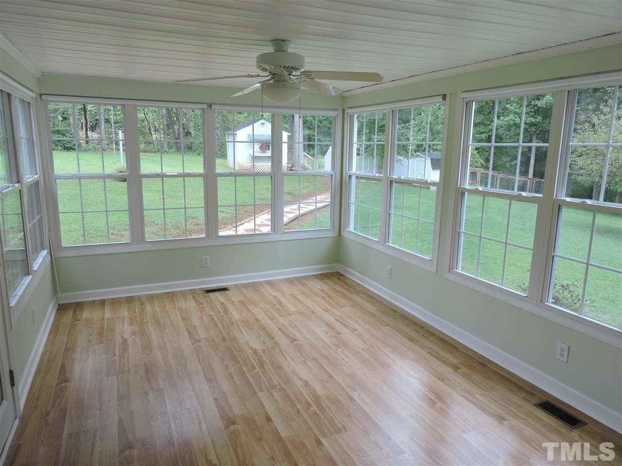 49 Epps Martin Road Roxboro, NC 27574 - Photo 10 of 25 a view of an empty room with wooden floor and a window